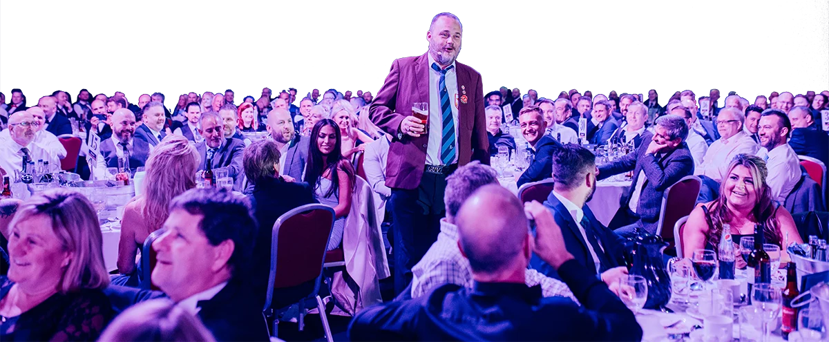 Large photo of Al Murray entertaining guests at the APEA Live awards dinner in 2021
